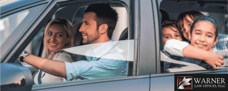 Man and his family inside a car