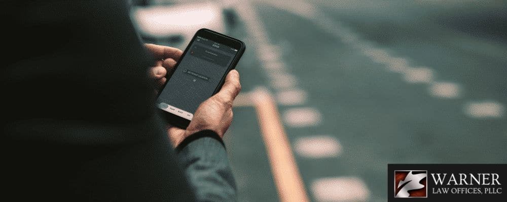 Man using the rideshare app on his smartphone